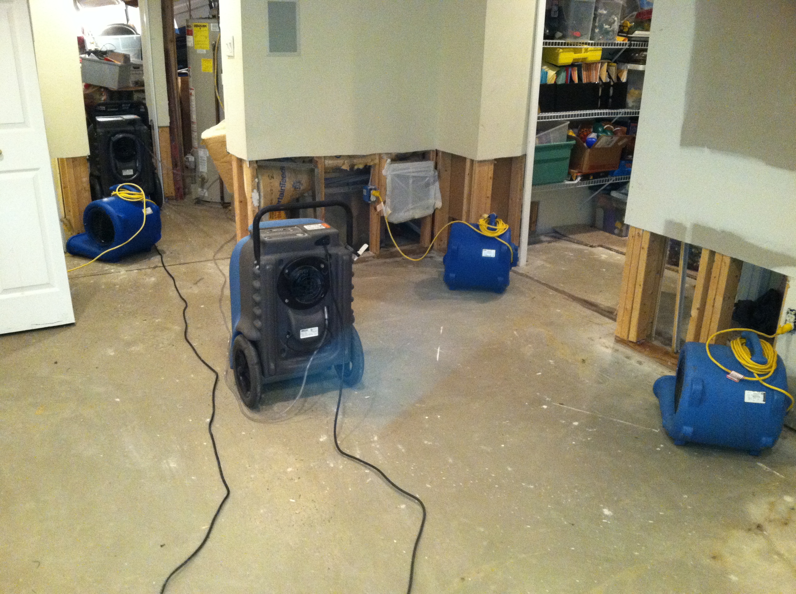 Image of drying fans in a previously flooded basement dwelling
