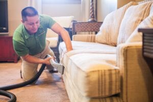 Image of Carpet Keepers team cleaning sofa